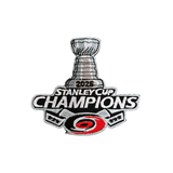 An embroidered patch celebrating the 2025 Stanley Cup Champions, featuring the Stanley Cup trophy, the text '2026 STANLEY CUP CHAMPIONS,' and the Carolina Hurricanes logo at the bottom.