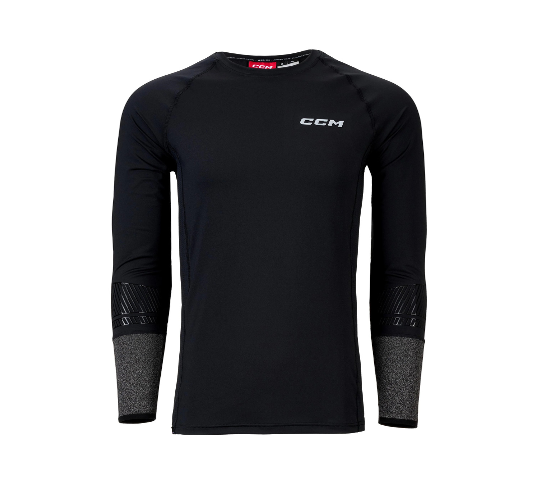 A black long-sleeve baselayer shirt by CCM with a grey logo on the chest and grey wrist protective sleeve cuffs.